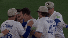 a group of baseball players including stefanic and bargea hug each other