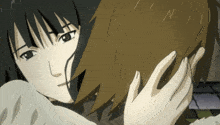 a couple of anime characters are hugging each other and the letters n and i are visible in the background