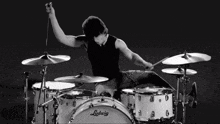 a man is playing drums with a ludwig drum set