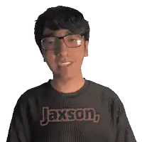 a young man wearing glasses and a shirt that says jaxson on it