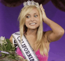 a woman is wearing a california sash and a tiara