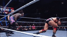 two men are wrestling in a ring with the words vengeance on the screen