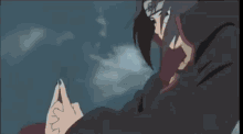itachi uchiha from naruto is wearing a hooded cloak and holding a fireball in his mouth .