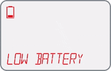 a digital screen displays the word low battery