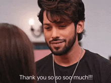 a man with a beard and a necklace says thank you so so soo much