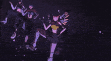 a group of people are dancing in a dark room