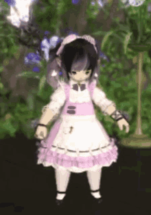 a little girl in a pink and white dress is standing in front of a plant .