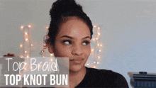 a woman wearing a top braid top knot bun hairstyle