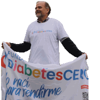 a man holding a banner that says diabetescero on it