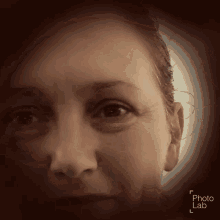 a close up of a woman 's face with the words photo lab below