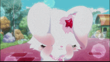 a white rabbit with a pink flower on its head