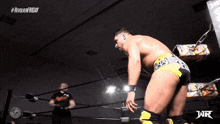 a man in a wrestling ring with the words revolver friday on the bottom