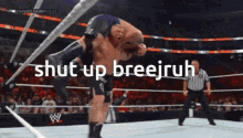 a wrestling match with the words shut up breejruh