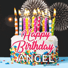 a birthday cake with candles and fireworks and the name angel on it .