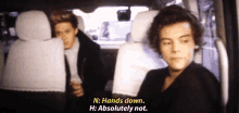 two men are sitting in the back seat of a car and one of them is saying n hands down h : absolutely not .
