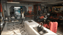 a kitchen with a sink and a motorcycle on the floor