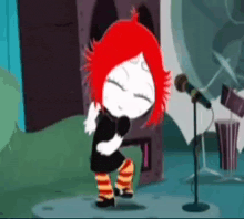 a little girl with red hair is singing into a microphone .