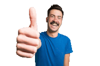 a man in a blue shirt is giving a thumbs up sign