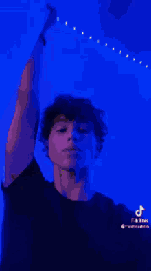 a pixelated image of a young man making a funny face