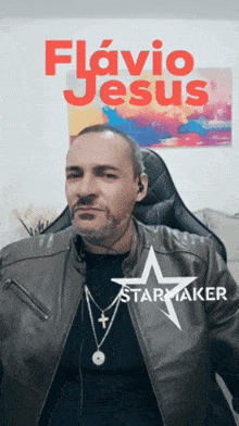 a man wearing a leather jacket and a starmaker necklace