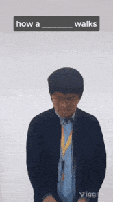 a man is standing in front of a white wall with the words how a walks written above him