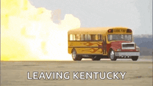 a school bus with flames painted on it is driving down a road