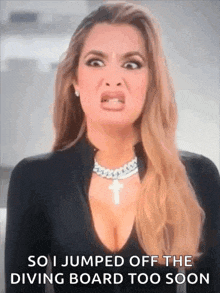 a woman is making a funny face and saying `` so i jumped off the diving board too soon ''