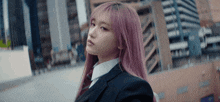 a girl with pink hair and a suit and tie