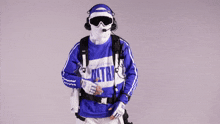 a person wearing a blue and white shirt that says ultra on it