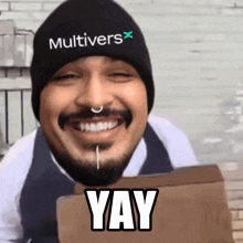 a man wearing a beanie that says multivers x