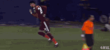 a soccer player is jumping in the air on the field