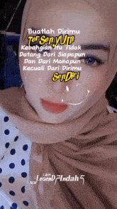 a woman wearing a hijab has a quote on her face