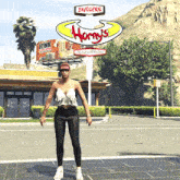 a woman standing in front of a horny 's burgers sign
