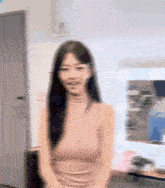 a blurry picture of a woman wearing a pink top