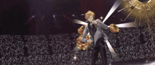 a man in a suit singing into a microphone on a stage
