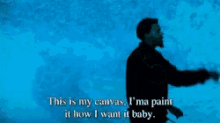 a man singing into a microphone with the words " this is my canvas "