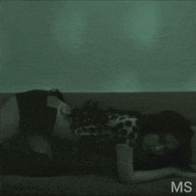 a woman laying on a couch with the letters ms on the bottom right