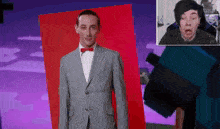 a man in a suit and red bow tie is standing in front of a red background
