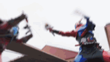 a blurry picture of a person holding a sword while another person holds a sword .