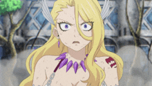 a girl with blonde hair and a purple necklace looks angry