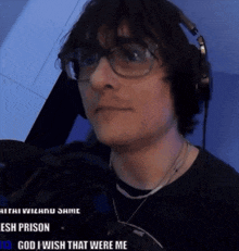 a man wearing glasses and headphones with the words god i wish that were me on the bottom
