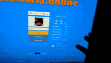 a person 's hand is on a computer screen that says ' online ' on the top