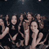 a group of women are posing for a picture together