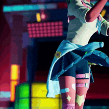 a girl with a flower on her waist is dancing