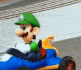 a cartoon character named luigi is driving a blue race car