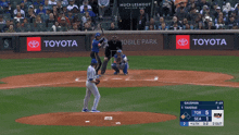 a baseball game is being played in front of toyota signs