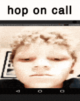 a screenshot of a boy 's face with the words hop on call above it