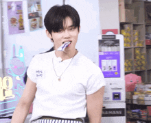 a man wearing a white shirt with a name tag that says ' kim '
