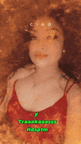 a woman in a red tank top is surrounded by flames and has ciao written on her face