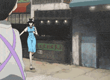 a woman in a blue dress is running in front of a fruit stand with chinese writing on it